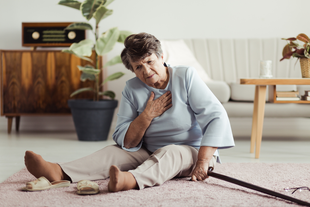 Senior woman sitting on floor after having fallen. 